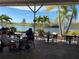 Outdoor restaurant with views of the water and a lush tropical landscape at 407 Feltham Trl # A, Sun City Center, FL 33573