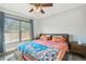 Bright bedroom features a window, ceiling fan and a comfortable bed at 4205 1St N Ave, St Petersburg, FL 33713