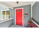 Charming red front door with gray siding and white trim creates curb appeal at 4205 1St N Ave, St Petersburg, FL 33713