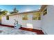 Back of house with a backyard patio area and landscaped details at 4586 12Th N Ave, St Petersburg, FL 33713