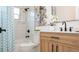 Stylish bathroom with a marble-tiled shower, a wood-finish vanity, and modern black fixtures at 4586 12Th N Ave, St Petersburg, FL 33713