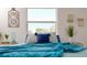 Cozy bedroom with natural light coming through the window and blue accents at 4586 12Th N Ave, St Petersburg, FL 33713