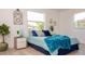 Inviting bedroom with a large window, stylish decor, and a comfortable bed at 4586 12Th N Ave, St Petersburg, FL 33713