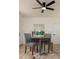 Cozy dining area with stylish chairs, modern ceiling fan, and contemporary decor, creating an inviting space for meals at 4586 12Th N Ave, St Petersburg, FL 33713