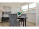 Charming dining room with a round table, patterned chairs, and a decorative painting at 4586 12Th N Ave, St Petersburg, FL 33713