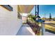 A quaint front porch showcasing decorative iron railing and brick exterior at 4586 12Th N Ave, St Petersburg, FL 33713