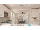 Modern kitchen featuring white cabinets, stainless steel appliances, and an open layout to the dining area at 4586 12Th N Ave, St Petersburg, FL 33713