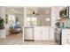 Bright and airy kitchen with stainless steel appliances, stylish cabinets, and open to the living area at 4586 12Th N Ave, St Petersburg, FL 33713