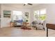 Sun-filled living room with neutral tones, large windows, and comfortable seating arrangements at 4586 12Th N Ave, St Petersburg, FL 33713