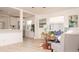 Open-concept living space with kitchen view, bright windows, and comfortable seating at 4586 12Th N Ave, St Petersburg, FL 33713