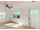 Inviting living room with light wood floors, bright windows, and fresh paint; great natural light at 4586 12Th N Ave, St Petersburg, FL 33713