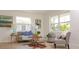 Comfortable living room featuring hardwood floors, bright windows and stylish furniture at 4586 12Th N Ave, St Petersburg, FL 33713