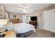 A roomy bedroom features light-colored walls and carpet and bright windows at 4821 Barchetta Dr, Land O Lakes, FL 34639