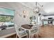 Charming dining area with bright windows and a view of the pool at 4821 Barchetta Dr, Land O Lakes, FL 34639
