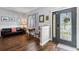 Inviting entryway with decorative glass door, wood floors, and window views with room for a sitting area at 4821 Barchetta Dr, Land O Lakes, FL 34639