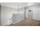 This carpeted hallway features neutral walls and trim and is naturally illuminated at 4821 Barchetta Dr, Land O Lakes, FL 34639