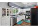 Well-lit kitchen featuring stainless appliances, granite counters, and white cabinetry at 4821 Barchetta Dr, Land O Lakes, FL 34639