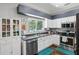 Cozy kitchen with white cabinets, granite countertops, and stainless steel appliances at 4821 Barchetta Dr, Land O Lakes, FL 34639