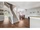 Open floor plan with hardwood floors, staircase, and dining area with elegant accents and natural lighting at 4821 Barchetta Dr, Land O Lakes, FL 34639