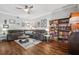 Open living space with a comfortable sectional sofa and beautiful wood floors at 4821 Barchetta Dr, Land O Lakes, FL 34639