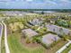 Aerial view of community amenity center featuring pickleball court, basketball court, and seating area at 4904 Eagle Rock Dr, Wimauma, FL 33598