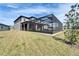 The backyard patio extends from the home, offering seamless indoor-outdoor living and entertaining options at 4904 Eagle Rock Dr, Wimauma, FL 33598