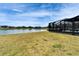 Expansive backyard view of the lake providing a tranquil view and natural backdrop at 4904 Eagle Rock Dr, Wimauma, FL 33598