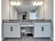 Bathroom showcases double vanities, granite countertops, and recessed lighting at 4904 Eagle Rock Dr, Wimauma, FL 33598