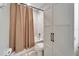 Bathroom showcasing a tiled shower and tub combo, linen closet and neutral shower curtain at 4904 Eagle Rock Dr, Wimauma, FL 33598