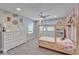 Charming bedroom featuring a stylish play bed with a pink patterned bedding and a dresser at 4904 Eagle Rock Dr, Wimauma, FL 33598