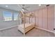 Charming bedroom featuring a stylish play bed with a pink patterned bedding and a window at 4904 Eagle Rock Dr, Wimauma, FL 33598