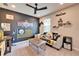 Nicely decorated 'Personal Cave' with Steelers theming, desk, neutral color palette, and carpeted flooring at 4904 Eagle Rock Dr, Wimauma, FL 33598