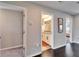 Hallway featuring doorways to a bedroom, bathroom, and another room in the home at 4904 Eagle Rock Dr, Wimauma, FL 33598
