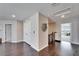Hallway with dark wood flooring, closet, and views of other rooms in the house at 4904 Eagle Rock Dr, Wimauma, FL 33598