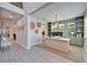 View of office with custom built-ins, a large desk, and a view into the foyer at 4904 Eagle Rock Dr, Wimauma, FL 33598