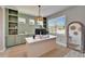 Inviting home office with built-in shelving, a spacious desk, and ample natural light at 4904 Eagle Rock Dr, Wimauma, FL 33598