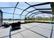 Expansive screened patio offering ample space for entertaining and relaxing, with serene water views at 4904 Eagle Rock Dr, Wimauma, FL 33598