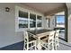 Covered outdoor dining area with stylish seating and a picturesque view, perfect for enjoying meals outdoors at 4904 Eagle Rock Dr, Wimauma, FL 33598