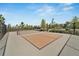Outdoor community pickleball court with green fencing and landscaping, offering a recreational amenity at 4904 Eagle Rock Dr, Wimauma, FL 33598
