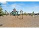 Community playground featuring swings and a multi-level play structure with slides and climbing features at 4904 Eagle Rock Dr, Wimauma, FL 33598