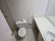 Bathroom with standard fixtures including toilet, sink, and tiled shower stall for a functional space at 5095 Bay Ne St # 310, St Petersburg, FL 33703