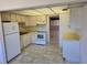Functional kitchen with standard appliances and view into adjacent living space at 5095 Bay Ne St # 310, St Petersburg, FL 33703