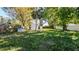 Spacious backyard with trees and an extra building for storage at 5712 Mallow St, New Port Richey, FL 34652