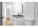 Stylish bathroom features a vanity with granite countertop and modern fixtures at 5712 Mallow St, New Port Richey, FL 34652