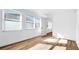 Well-lit bedroom with hardwood flooring at 5712 Mallow St, New Port Richey, FL 34652