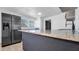 Bright kitchen features granite countertops and modern stainless steel appliances at 5712 Mallow St, New Port Richey, FL 34652