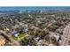 Aerial view of a neighborhood with mature trees with a glimpse of the bay in the distance at 5713 23Rd S Ave, Gulfport, FL 33707