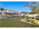 Wide backyard featuring lawn, cornhole game, and pergola at 5713 23Rd S Ave, Gulfport, FL 33707