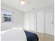 Bright bedroom with a large window, double closets and neutral decor with minimalist aesthetic at 5713 23Rd S Ave, Gulfport, FL 33707