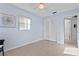 Bright and airy bedroom with serene blue walls, complemented by neutral decor and ample natural light at 5713 23Rd S Ave, Gulfport, FL 33707